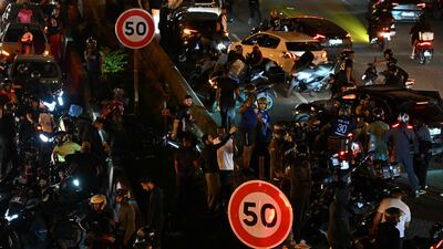 PSG supporters and motorists halt on the Peripherique between Porte Maillot and Porte Champerret in Paris. AFP