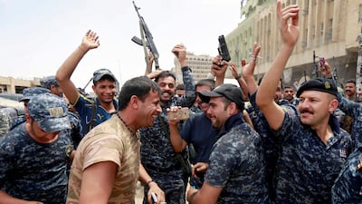 Iraqi Federal police celebrate in the Old City of Mosul and ISIL looked close to defeat