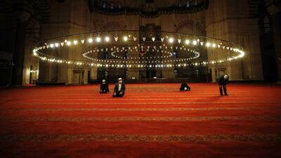 People offer prayers during Eid Al Fitr at Suleymaniye Mosque in Istanbul. AP Photo