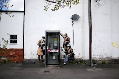 Artwork by Banksy on the side of a house in Cheltenham at a telephone box near GCHQ. Getty Images