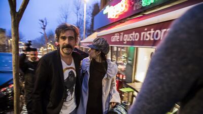 German-Turkish journalist Deniz Yucel and his wife, Dilek Mayaturk Yucel, are pictured in front of their home after Deniz Yucel was released from prison in Istanbul, Turkey. Depo Photos via Reuters