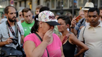 A woman reacts at the scene of the Barcelona terrorist attack. Manu Fernandez / AP Photo