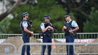 Armed police officers patrol gravesites for victims in Christchurch early on March 18, 2019, three days after a shooting incident killed at least fifty people in mosques in the city. AFP