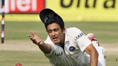 The India captain Anil Kumble fields a ball on the third day of the third Test against Australia.
