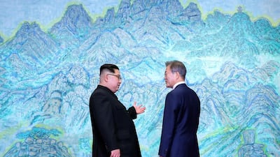 The leaders on discussion. Korea Summit Press Pool via AP