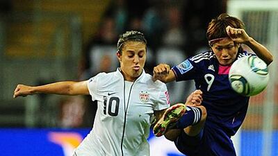 USA's Carli Lloyd, left, and Japan's midfielder Nahomi Kawasumi battle for the ball during the final. Japan won 3-1 on penalties after the final finished 2-2 after extra time.