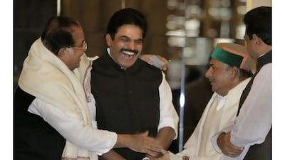 Newly appointed Indian ministers congratulate each other during a swearing-in ceremony in New Delhi. A reader expresses the hope that the new cabinet can overcome the corruption scandals of the old. Manish Swarup / AP