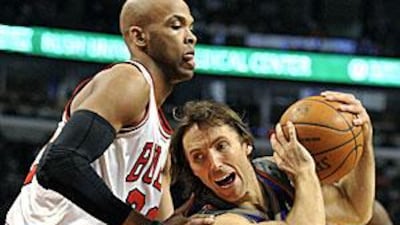 The Phoenix Suns' Steve Nash drives past Chicago's Taj Gibson.