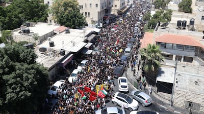 Hundreds of Palestinians join a funeral procession after 13 Palestinians were killed during an Israeli army raid in the occupied West Bank city of Jenin. EPA