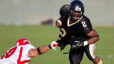 Vivaldi Tulysse, right, was too much for the Dubai Stallions to handle in the Desert Bowl, running for two touchdowns and intercepting two passes to lead the Abu Dhabi Wildcats to the inaugural EAFL title with a 21-12 victory.