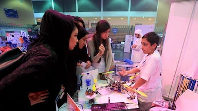 Arjun Bhorkar, a grade 7 student from Millennium School in Dubai with his invention, the Quad Copter, at the Innovator 2014 Exhibition. Ravindranath K / The National
