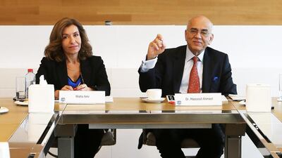 Masood Ahmed, the IMF regional director, right, said that overall growth in the UAE would fall to 2.3 per cent this year, down from 4 per cent last year. On the left is IMF's senior communications officer Wafa Amr. Pawan Singh / The National