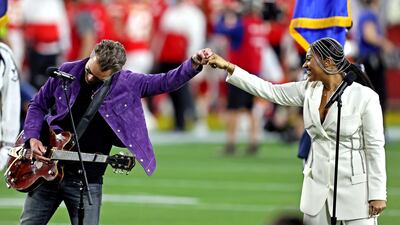 Jazmine Sullivan and Eric Church perform the national anthem before Super Bowl LV. Matthew Emmons