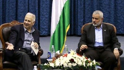 The Palestinian central elections commission chairman, Hanna Nasser, left, and the Hamas prime minister, Ismail Haniya, meet in Gaza City on Monday to prepare the way for long-overdue elections, a major step toward repairing a five-year rift between the two territories.
