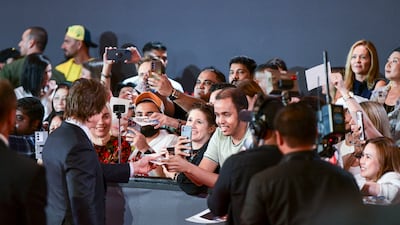Fans take photos with Cruise