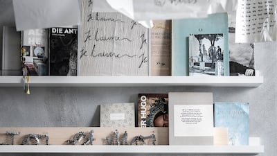 Pick up an Ikea picture ledge and place as many frames and prints as will fit on it.