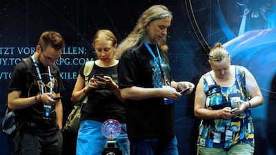 Visitors attend the Gamescom fair. Ralph Orlowski / Reuters
