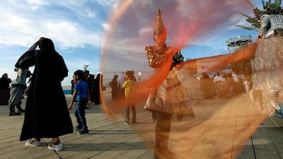 An artist performs using silks on the last day of the Mother of the Nation Festival, celebrating Sheikha Fatima's life, in Abu Dhabi.