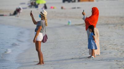 The emirate's public and private hotel beaches were popular locations after Covid-19 restrictions were eased in May 2020. Masks should be worn out of the water.