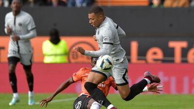 Lorient's Burkinabe forward Dango Ouattara fights for the ball with Paris Saint-Germain's French forward Kylian Mbappe. AFP