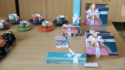 Gift boxes with special art motifs on display in the cafe at the studio. Pawan Singh / The National