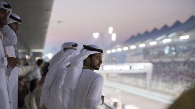 Sheikh Zayed bin Hamdan bin Zayed, centre, watches the final of the 2014 Formula 1 Etihad Airways Abu Dhabi Grand Prix at Yas Marina Circuit. Rashed Al Mansoori / Crown Prince Court — Abu Dhabi