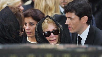 Princess Ashraf (centre), the sister of the late shah of Iran, leaves the American Cathedral in Paris on November 6, 2001 following funeral services for princess Soraya Esfiandiary-Bakhtiary, the second wife of the late Iranian monarch. AFP