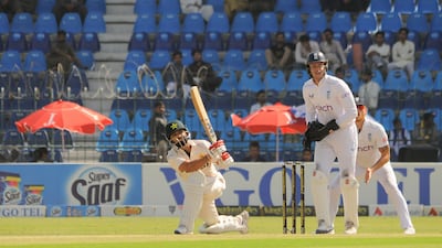 Pakistan's Kamran Ghulam plays a shot on his way to making 118 on his debut. EPA