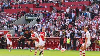 Jamal Musiala of Bayern Munich scores the team's second goal against Cologne at the RheinEnergieStadion. Getty