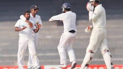 Rangana Herath, left, pegged Bangladesh back with two quick wickets. Eranga Jayawardena / AP Photo