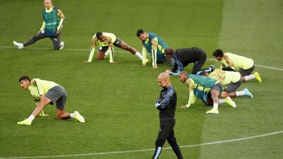 Manchester City manager Pep Guardiola and the players during training. Reuters