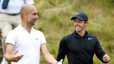 Northern Ireland's Rory McIlroy shares a joke with Manchester City manager Pep Guardiola during the pro-am at the Irish Open.
