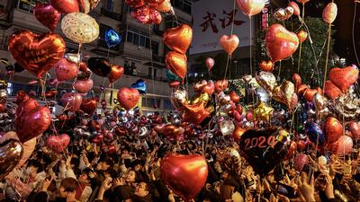 Balloons are released to celebrate the new year on Jianghan Road in Wuhan, China. Getty Images
