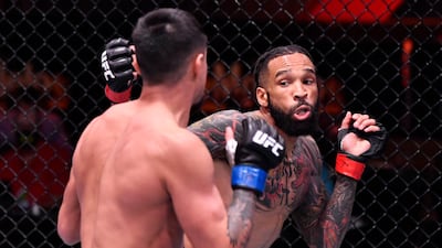 Andre Ewell, right, punches Chris Gutierrez in their 140-pound catchweight fight during the UFC 258 event at UFC APEX in Las Vegas, Nevada. Jeff Bottari / Zuffa LLC / UFC