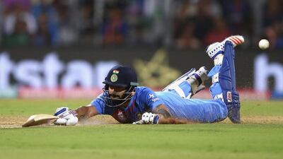 Virat Kohli of India dives to make his ground during the ICC World Twenty20 India 2016 Semi Final match between West Indies and India at Wankhede Stadium on March 31, 2016 in Mumbai, India. (Photo by Ryan Pierse/Getty Images)