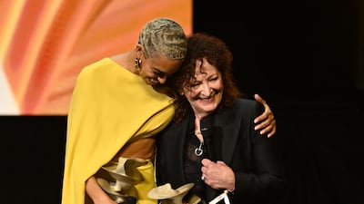 Cellis Kelsey Lu accompanies photographer Nan Goldin as she accepts the Special Recognition Award