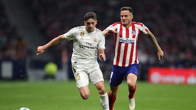 MADRID, SPAIN - SEPTEMBER 28: Federico Valverde of Real Madrid battles for the ball with Saul of Atletico Madrid during the Liga match between Club Atletico de Madrid and Real Madrid CF at Wanda Metropolitano on September 28, 2019 in Madrid, Spain. (Photo by Angel Martinez/Getty Images)