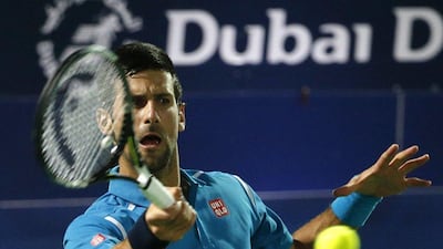Novak Djokovic of Serbia returns the ball to Tunisian Malek Jaziri during their ATP tennis match on the third round of the Dubai Duty Free Tennis Championships on February 24, 2016. AFP / KARIM SAHIB