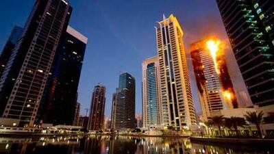 The residential tower in Jumeirah Lakes Towers on fire during the blaze which left hundreds homeless. Kaveh Kashani / AP Photo