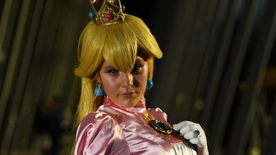 One lady dresses up as Princess Peach, a character from Nintendo's Mario franchise. EPA