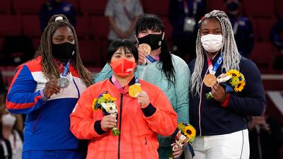 From left, silver medalist Idalys Ortiz of Cuba, gold medalist Akira Sone of Japan, and bronze medalists Iryna Kindzerska of Azerbaijan and Romane Dicko of France pose during the medal ceremony for women's +78 judo competition.