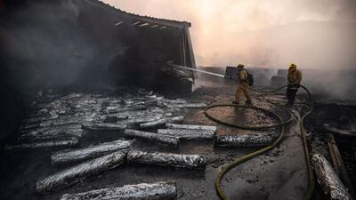 Firefighters work at extinguishing the Tick Fire in a factory near Santa Clarita. EPA