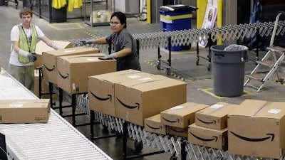 Online spending in the Gulf is projected to rise about 30 per cent this year and reach close to $15bn in 2015. Ross Franklin / AP Photo