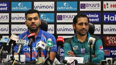 India captain Rohit Sharma, left, and Pakistan counterpart Sarfraz Ahmed attend a press conference ahead of the Asia Cup. AP Photo