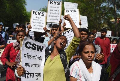Activists and students stage a protest in New Delhi on April 12, 2018 over the rape of an 8-year-old in Jammu and Kashmir and another rape case involving a politician Uttar Pradesh state. Sajjad Hussain / AFP