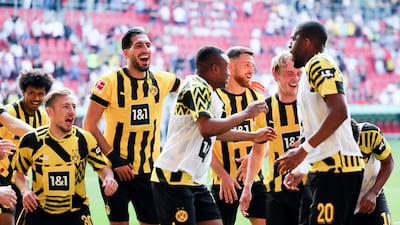 Borussia Dortmund players celebrate their win over Augsburg. EPA
