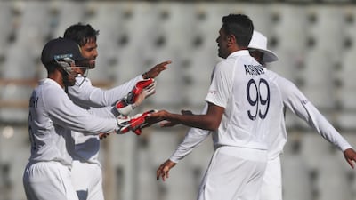 India spinner Ravichandaran Ashwin, right , celebrates the dismissal of New Zealand's Ross Taylor for six. AP