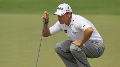 Lee Westwood lines up a put at the Masters.