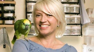 Rowena Bird with her pet parrot, Mary.