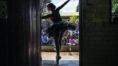 Senior soloist of the Joburg Ballet Kitty Phetla performs in a classroom at the Nka-Thuto Primary School in Soweto on October 16. Using ballet and dance to promote healthy and positive choices, Joburg Ballet provided lecture demonstrations to 20 schools in Soweto, raising awareness and informing students of the available free classes they provide together with the provincial department of education. Marco Longari / AFP